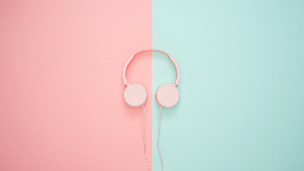 Headphones laying on colorful background